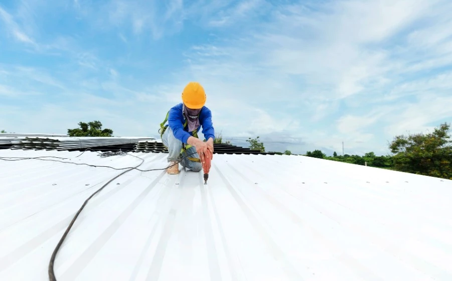 Installing new commercial roofing metal sheets