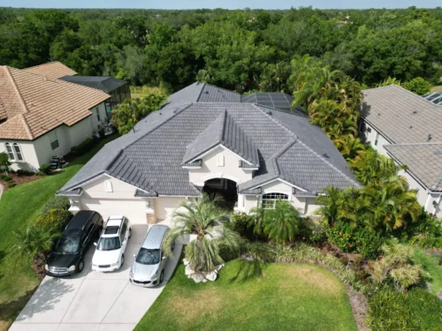 Dark tile roof replacement on a Sarasota, FL home — aerial view 1